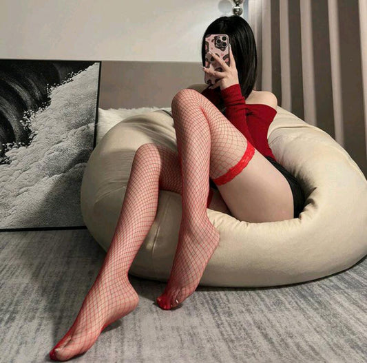 Woman in festive lingerie and fishnet stockings. Darling- Thigh-High Fishnet Stockings- Red Mi Amore lingerie stockings adding a touch of allure to your ensemble. Elevate your style with the best lingerie stockings in Trinidad and Tobago
Mi Amore House of Styles