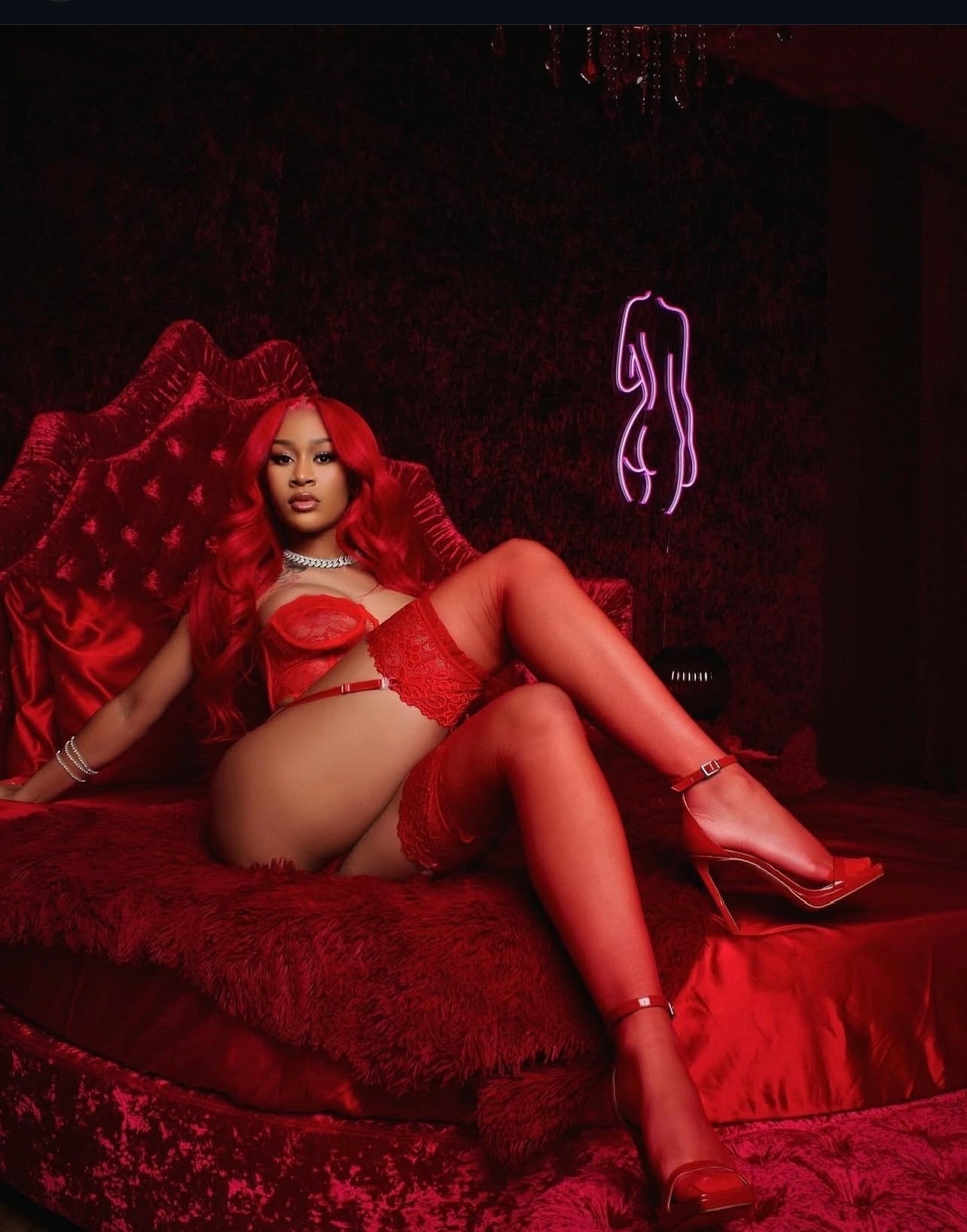 Woman in red lingerie and high heels on a red couch with a dark background. Almost Mine- Thigh-High Lace Stockings- Red.Mi Amore lingerie stockings adding a touch of allure to your ensemble. Elevate your style with the best lingerie stockings in Trinidad and Tobago."
Mi Amore House of Styles

