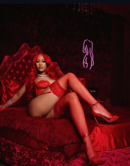 Woman in red lingerie and high heels on a red couch with a dark background. Almost Mine- Thigh-High Lace Stockings- Red.Mi Amore lingerie stockings adding a touch of allure to your ensemble. Elevate your style with the best lingerie stockings in Trinidad and Tobago."
Mi Amore House of Styles

