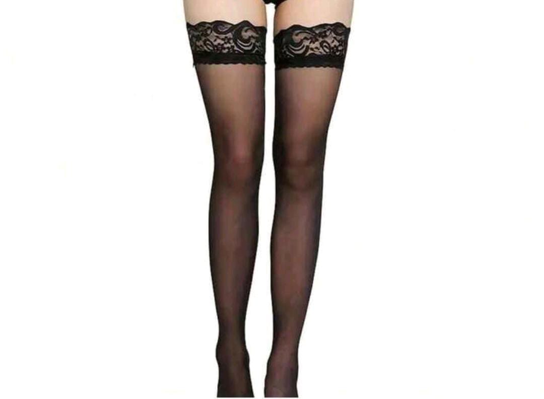 Woman in a black swimsuit and stockings lying on a beige couch. Almost Mine- Thigh-High Lace Stockings- Black. Mi Amore lingerie stockings adding a touch of allure to your ensemble. Elevate your style with the best lingerie stockings in Trinidad and Tobago.
Mi Amore House of Styles