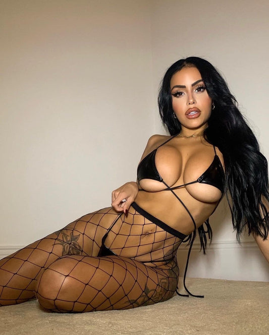 Woman wearing a black strappy top and fishnet stockings against a neutral background. Call Me Baby- Fishnet Stockings- Black (One Size)"Lingerie Stockings Collection: Elevate your ensemble with Mi Amore lingerie stockings, adding a touch of allure. Find the best lingerie stockings in Trinidad and Tobago."
Mi Amore House of Styles